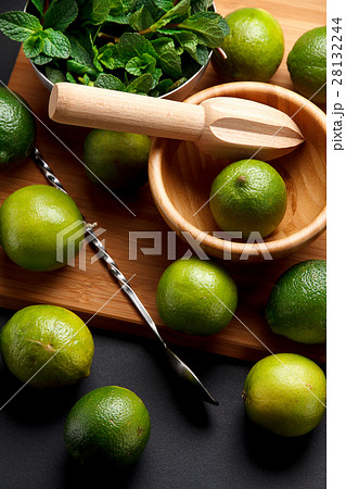 Lime is ready for juicing on a black table 28132244