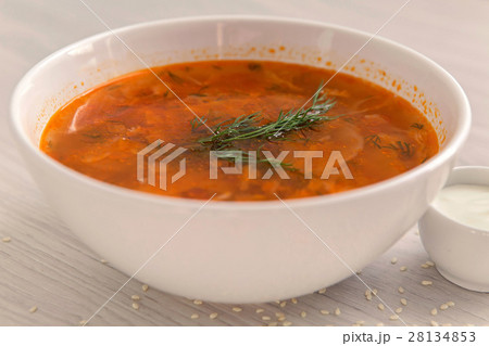 red soup in white plate on the table with sour 28134853
