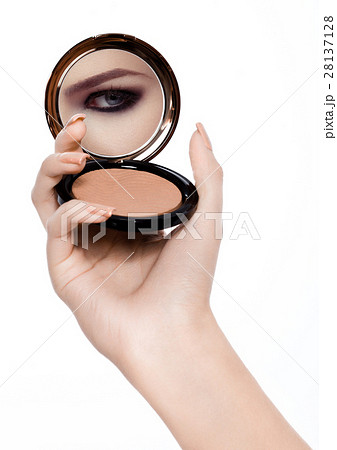Arm holding powder foundation mirror reflection Arm holding powder foundation mirror reflection 28137128