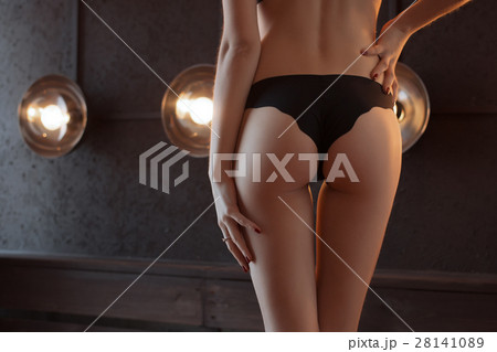 young woman with a pretty ass in white panties Stock Photo