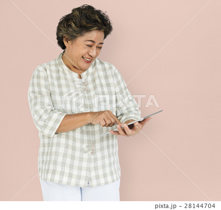 Mature Woman Holding Tablet Concept 28144704