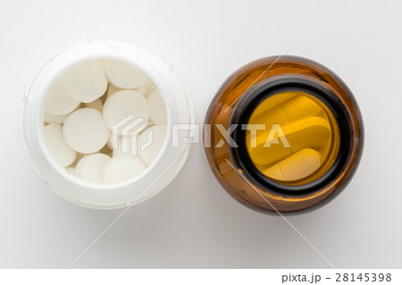 Top view of two bottles of different pills 28145398