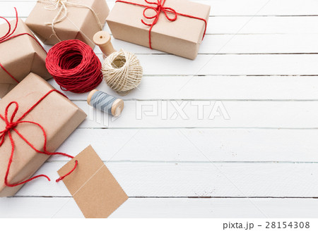 Homemade wrapped rustic brown paper packages on 28154308