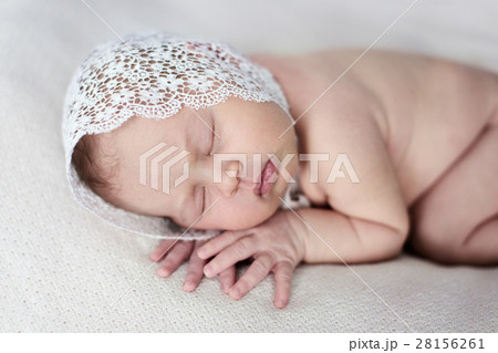 newborn sleeping on stomach light background,  28156261
