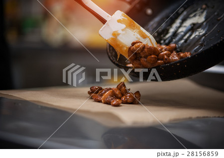 Preparing almond caramel on restaraunt kitchen Preparing almond caramel on restaraunt kitchen 28156859