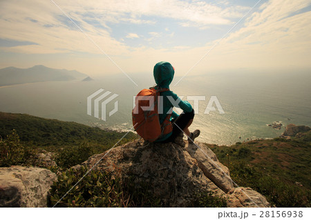 successful hiker on seaside mountain peak rock successful hiker on seaside mountain peak rock 28156938