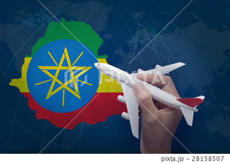 hand holding airplane with map of Ethiopia. hand holding airplane with map of Ethiopia. 28158507