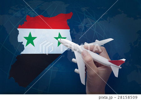 hand holding airplane with map of Syria. hand holding airplane with map of Syria. 28158509