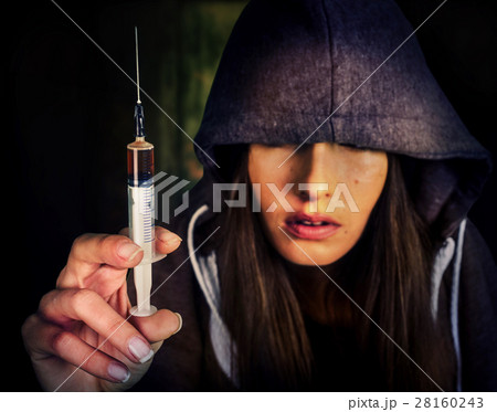 Heroin needle in addict narcotic woman's hand. Heroin needle in addict narcotic woman's hand. 28160243