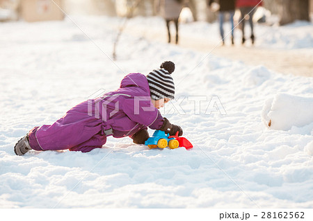 Kid plays on the snow Kid plays on the snow 28162562