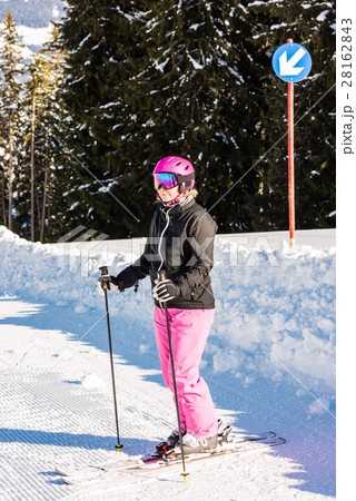 attractive middle aged woman with ski and snow 28162843