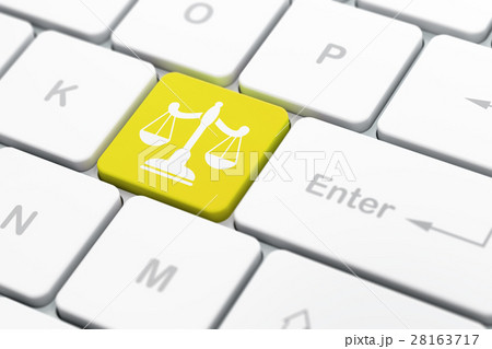 Law concept: Scales on computer keyboard Law concept: Scales on computer keyboard 28163717