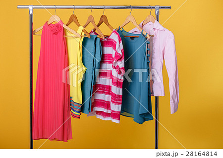 colorful womens clothes on hangers on rack on colorful womens clothes on hangers on rack on 28164814