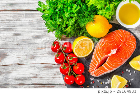 portion of fresh salmon steak with aromatic herbs portion of fresh salmon steak with aromatic herbs 28164933