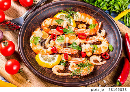 prawn tails, fried in olive oil with spices prawn tails, fried in olive oil with spices 28166038
