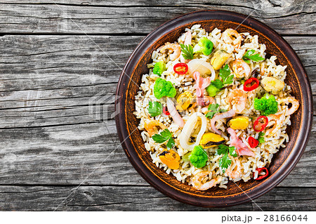 rice with seafood and broccoli in a bowl, top view 28166044