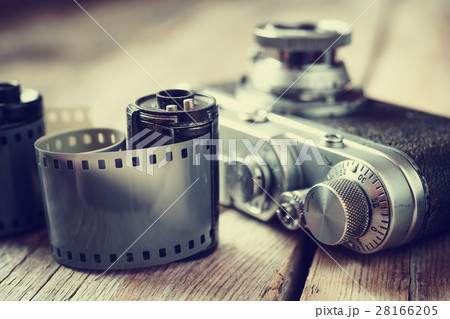 Old photo film rolls, cassette and retro camera 28166205