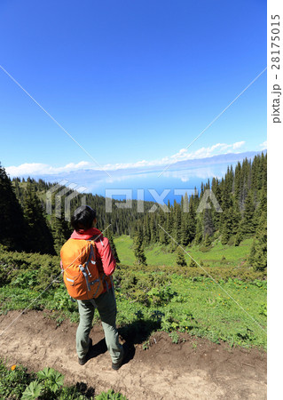 successful hiker hiking on mountain peak 28175015