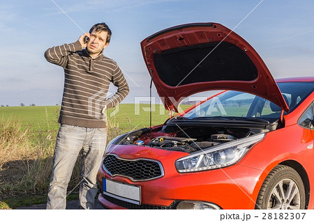 Man is calling help for broken car. Insurance and assistance con Man is calling help for broken car. Insurance and assistance con 28182307