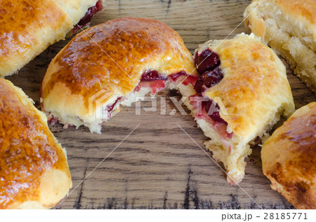 Homemade cakes with cherries on wooden table. 28185771