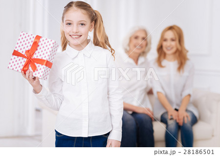 Pretty little smiling girl holding present Pretty little smiling girl holding present 28186501