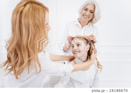 Positive family members wearing accessories Positive family members wearing accessories 28186670