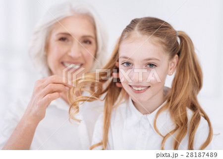 Loving positive senior woman taking care of her 28187489