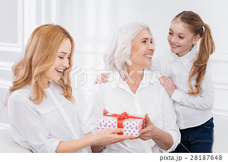 Joyful family members holdign present 28187648