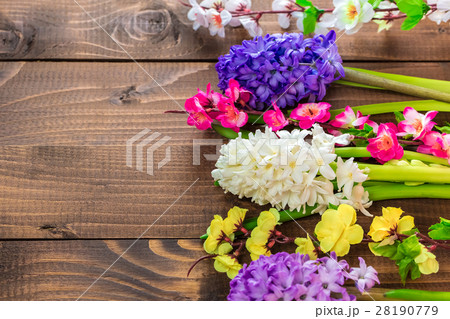 Fresh hyacinth flowers on wooden background. 28190779
