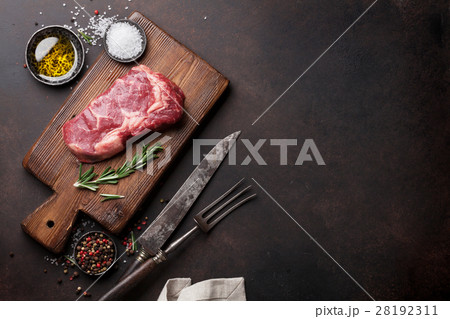 Raw ribeye beef steak cooking with ingredients 28192311
