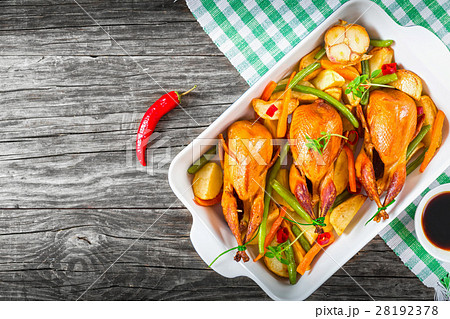 quails baked with vegetables, top view, close-up quails baked with vegetables, top view, close-up 28192378