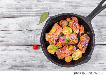 ribs fried in an olive oil in a frying pan 28192655
