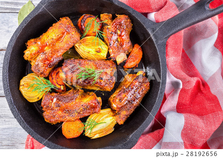 ribs fried with virgin olive oil in a frying pan ribs fried with virgin olive oil in a frying pan 28192656