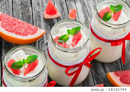 yogurt with grapefruit and mint in a glass jars yogurt with grapefruit and mint in a glass jars 28192794