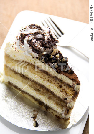 Tiramisu cake on a white plate Tiramisu cake on a white plate 28194897