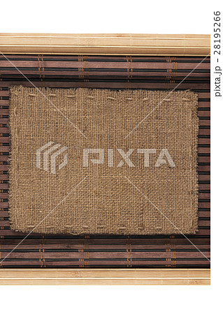 Frame made of burlap lying on a bamboo mat Frame made of burlap lying on a bamboo mat 28195266