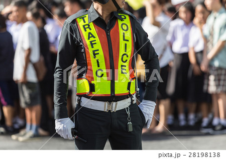 Traffic police standing on the road while doing the work 28198138