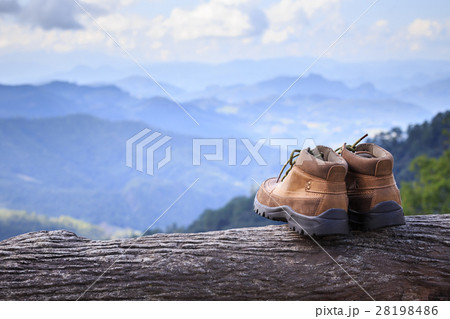 New brown leather shoe on mountain view point. Adventure concept 28198486
