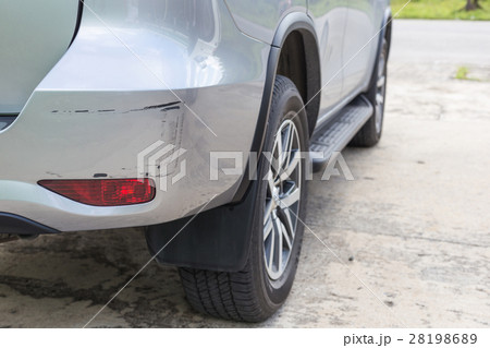 Backside of silver SUV car get scratched, damaged by accident 28198689