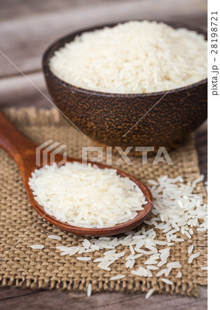 White Thai jasmine rice on wooden plank White Thai jasmine rice on wooden plank 28198721