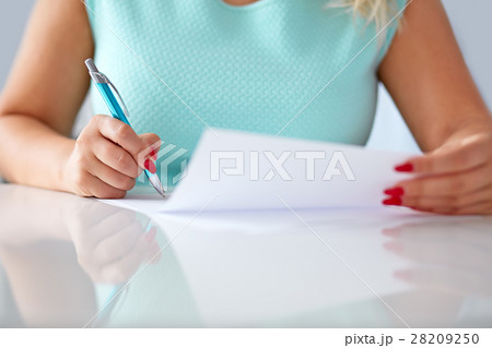 Young woman signs a contract Young woman signs a contract 28209250