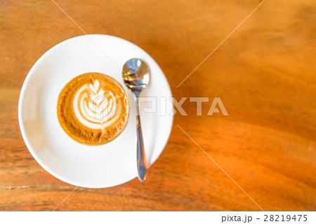 A cup of hot coffee in morning. 28219475