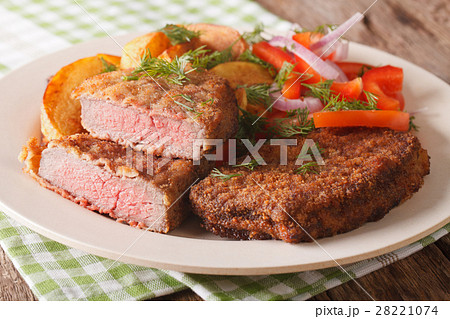 Fried Breaded rump steak with potato Fried Breaded rump steak with potato 28221074