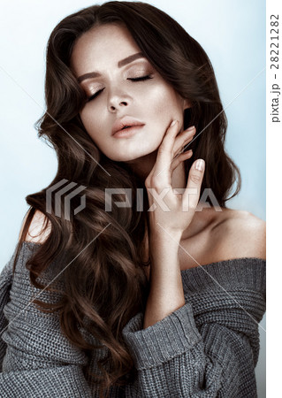 Beautiful woman with healthy skin and hair curls Beautiful woman with healthy skin and hair curls 28221282