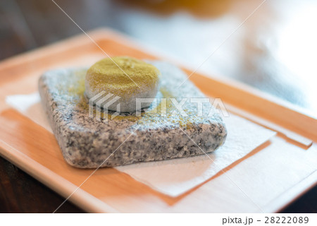 Green tea mo chi on stone plate; japanese cuisine. Green tea mo chi on stone plate; japanese cuisine. 28222089
