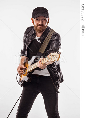 Bassist plays bass guitar. Bassist plays bass guitar. 28223603