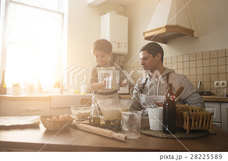 A father and his son cooking 28225589