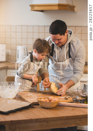 A father and his son cooking A father and his son cooking 28225657