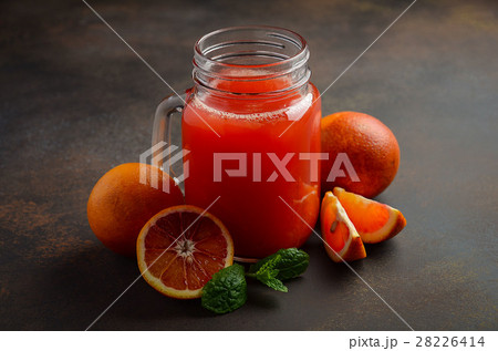Fresh blood orange juice in mason jar. 28226414