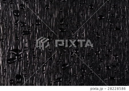 Water drops on dark stone Water drops on dark stone 28228586